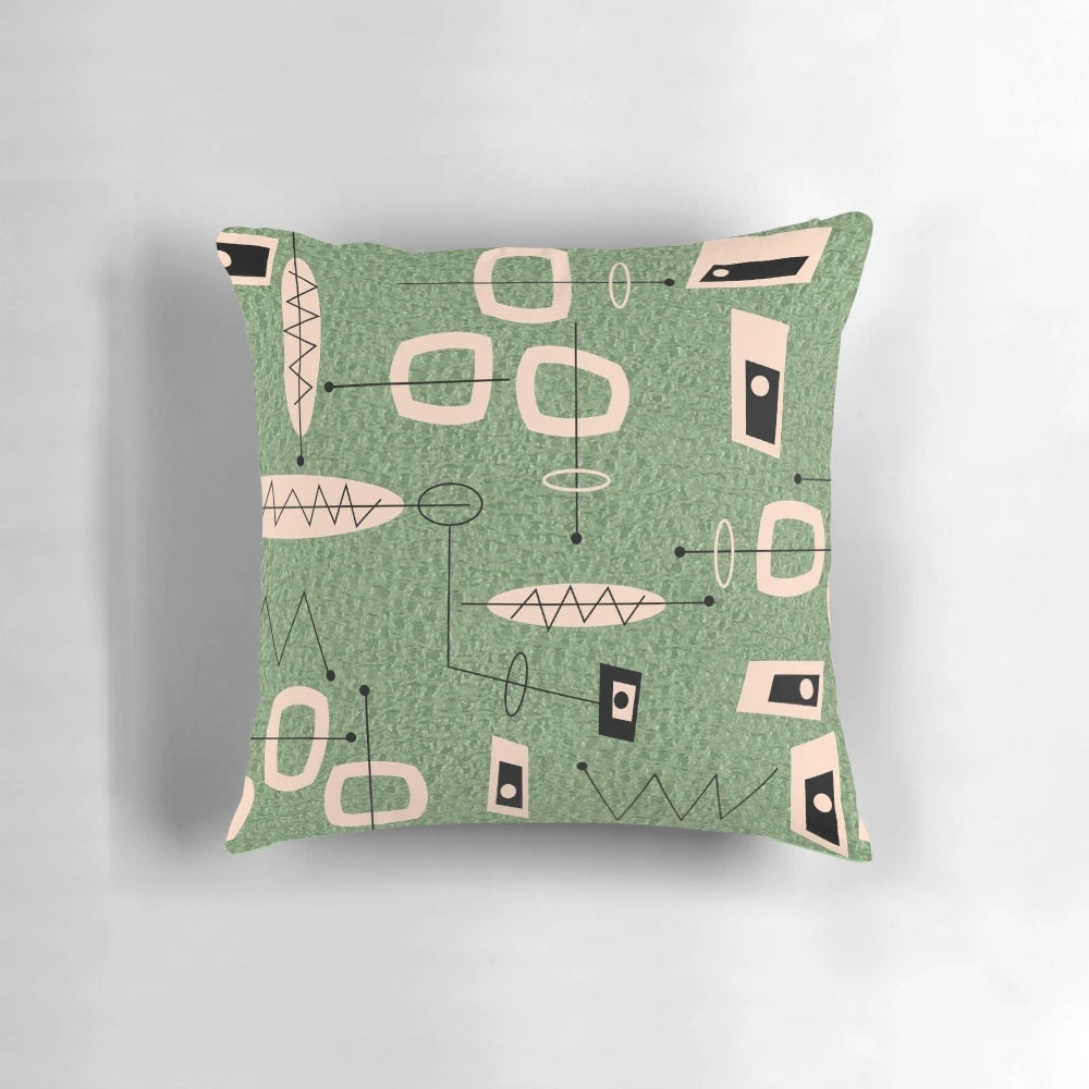 Mid-century modern abstract green pillow with atomic-inspired design