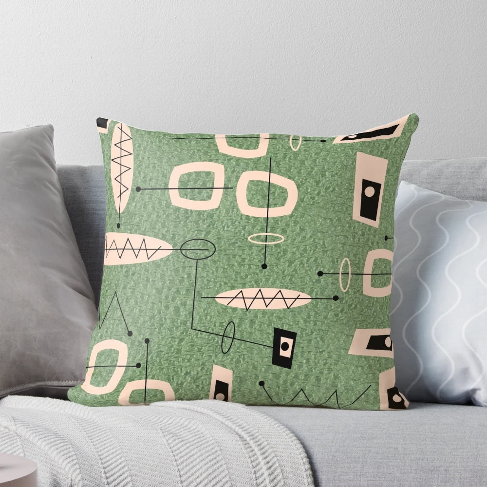 Mid-century modern abstract green pillow with atomic-inspired design