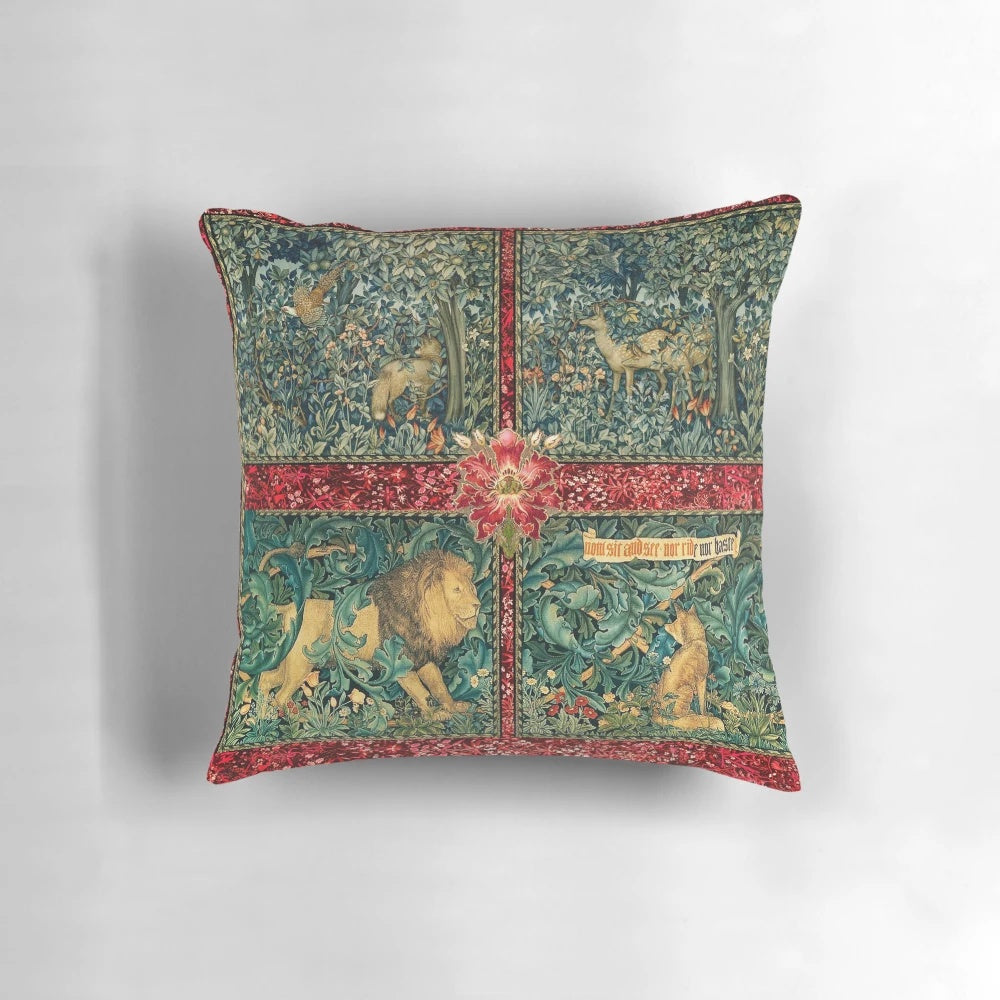 Decorative tapestry pillow featuring a green floral design with forest animals like a lion, fox, pheasant, and deer.
