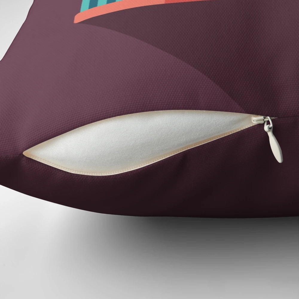 A pillow featuring a retro camera roll design, perfect for photography enthusiasts.