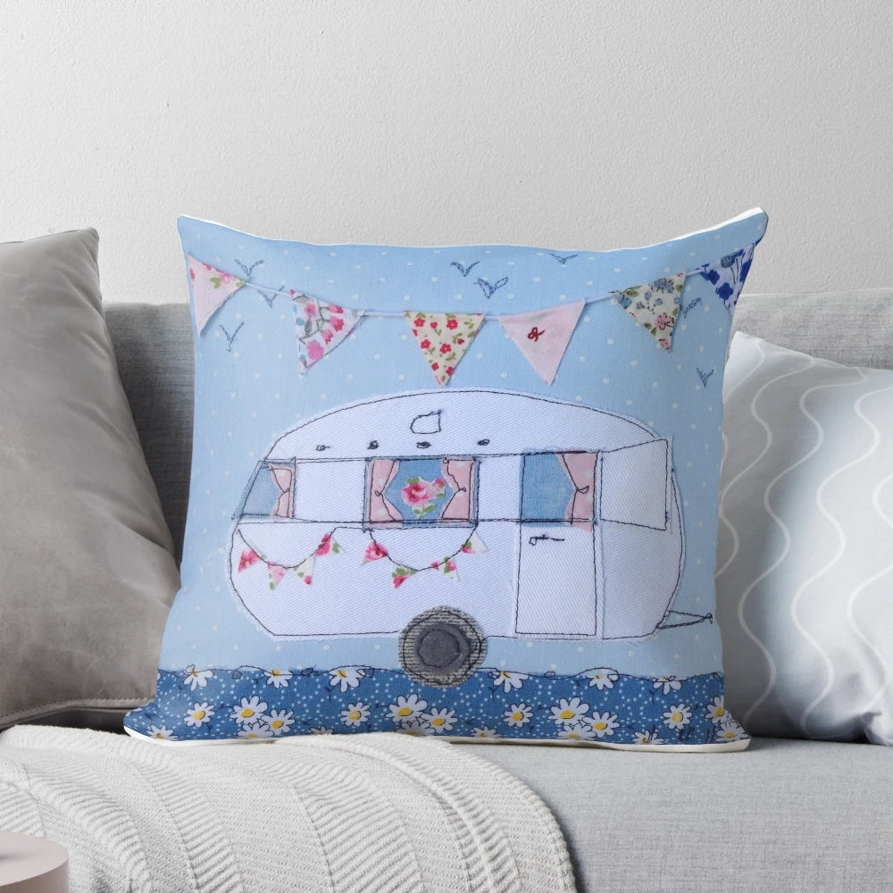Retro-style white caravan or camper van-inspired decorative pillow with appliqué and embroidered details