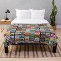 Cozy cassette tape plush blanket featuring a retro music design