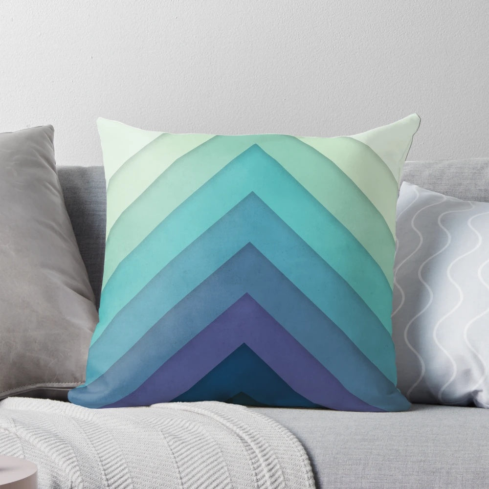 Retro-inspired chevron pattern pillow in a gradient color design