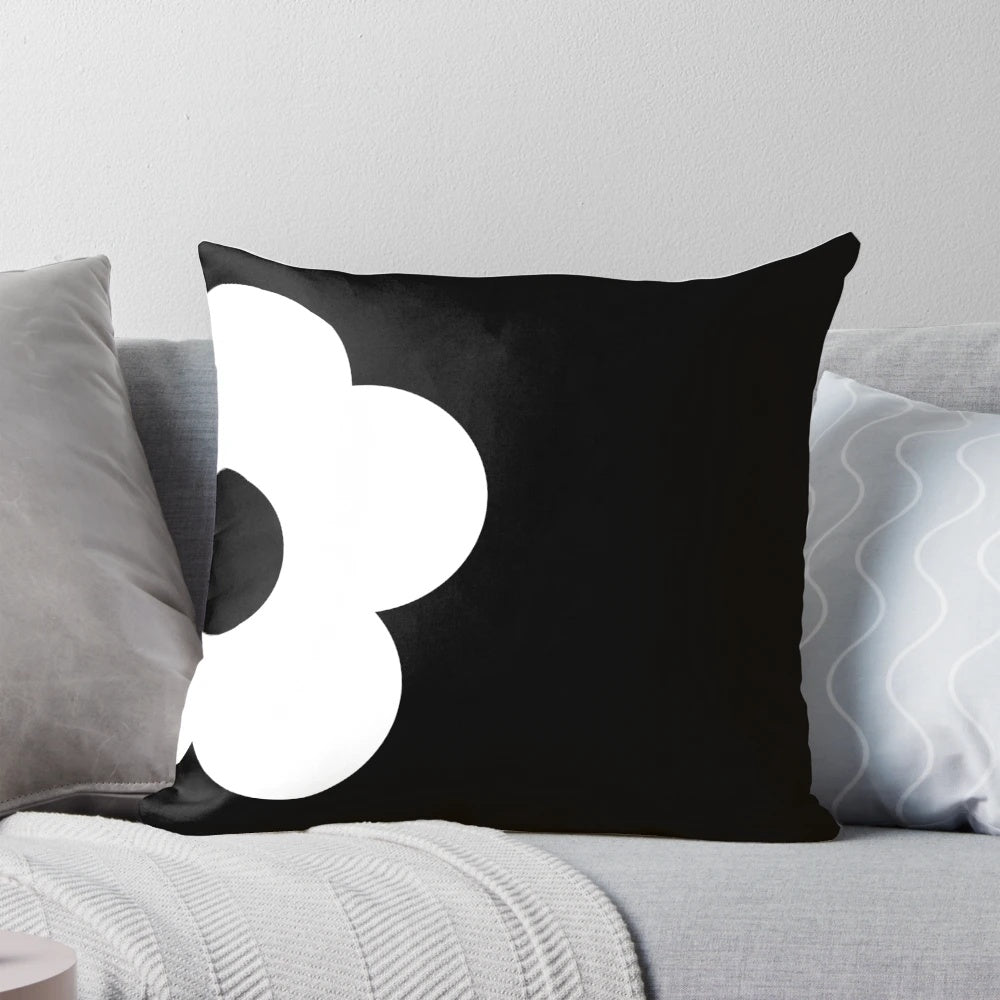 Retro-inspired black and white floral graphic decorative throw pillow