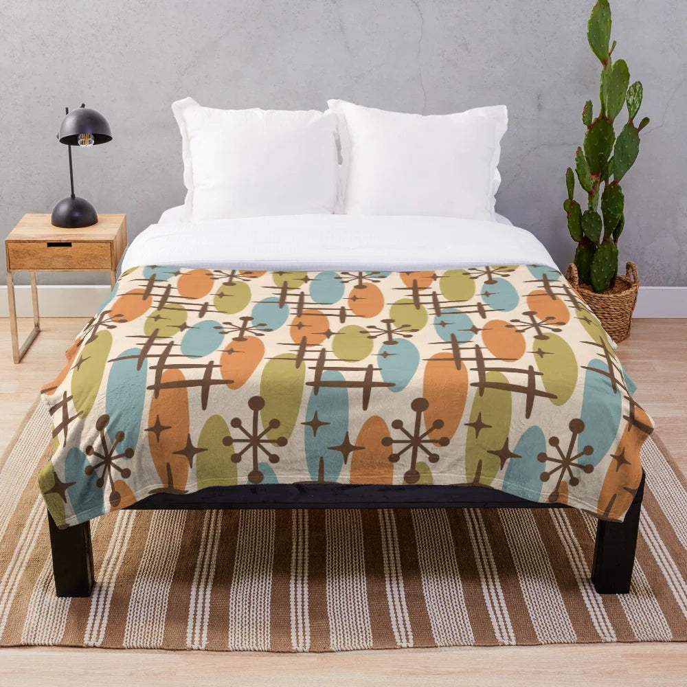 Colorful mid century modern style plush blanket with abstract cosmic surfing pattern