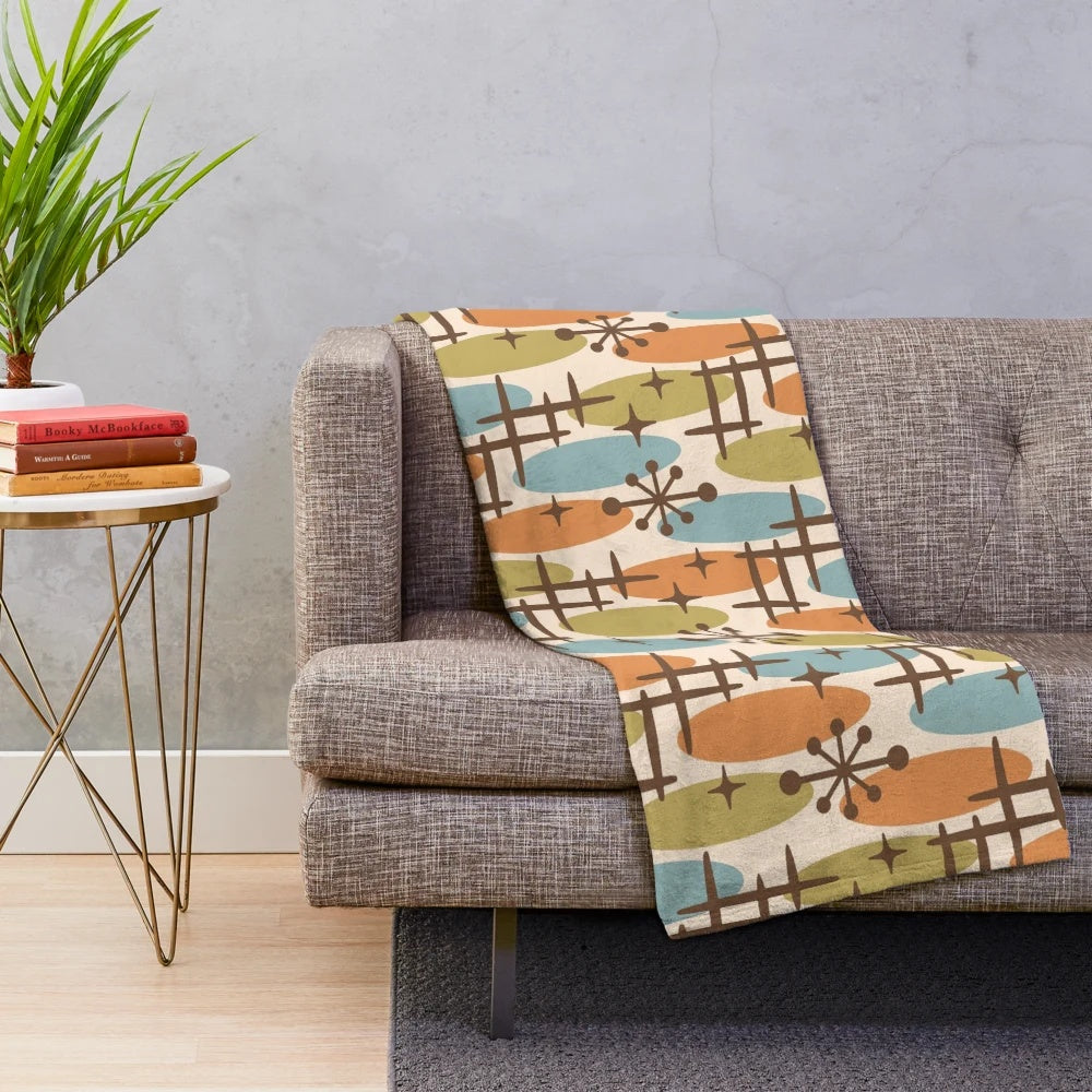 Colorful mid century modern style plush blanket with abstract cosmic surfing pattern