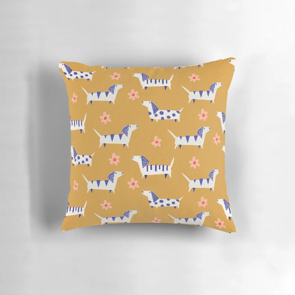 Vibrant retro-inspired dachshund dog paper cut pattern with daisy flowers on a decorative throw pillow.