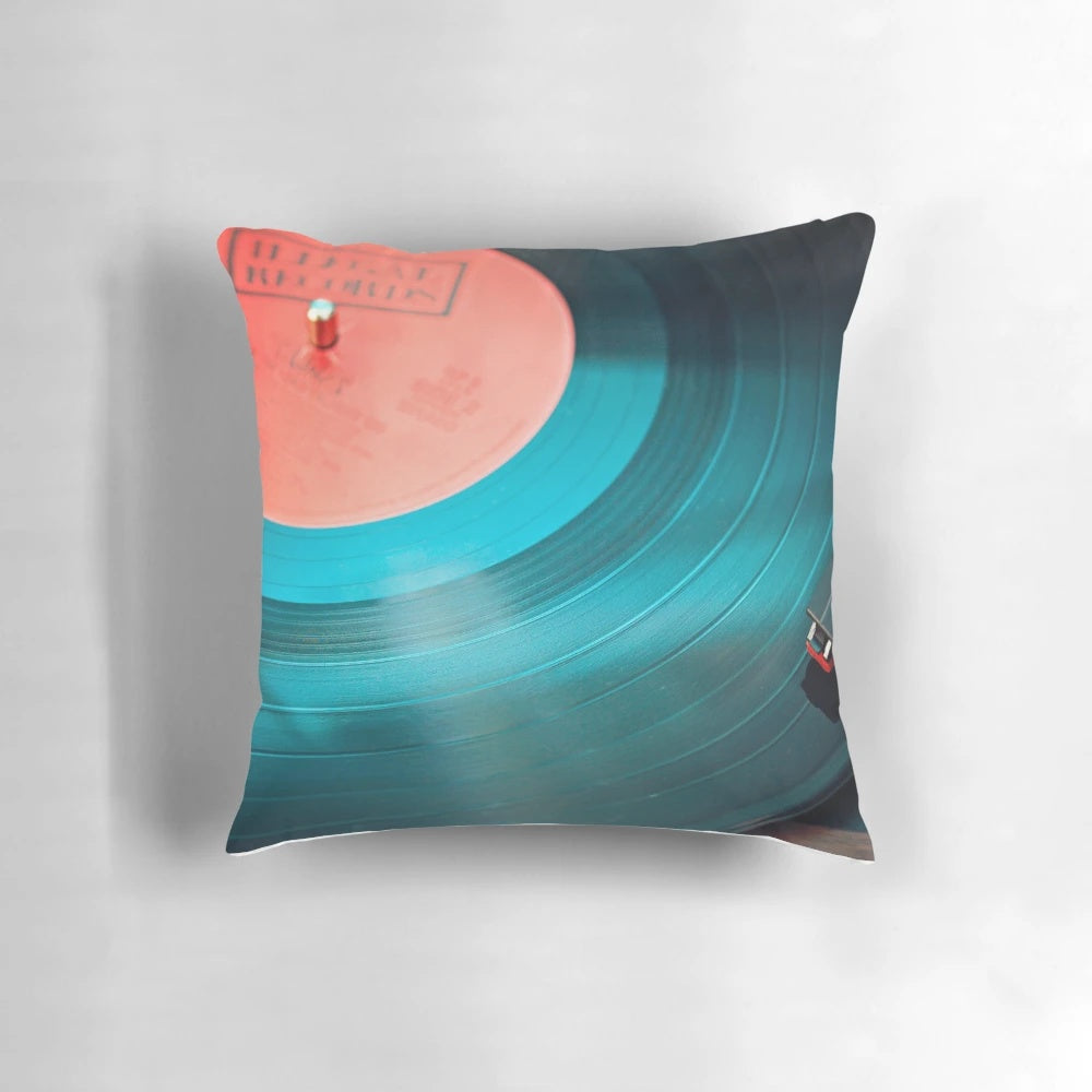 Soft, plush disk-shaped pillow inspired by vintage vinyl records for a retro music lover's home decor.