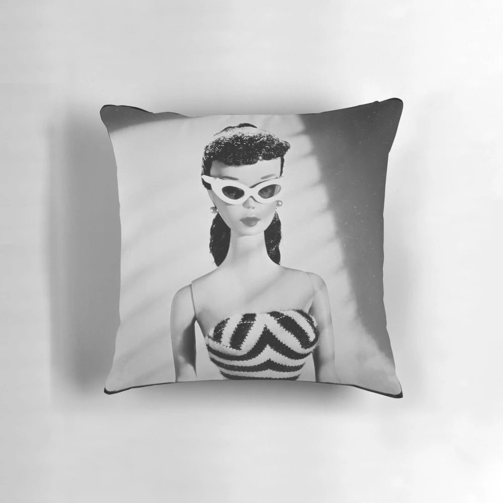 Vintage-style black and white decorative pillow featuring a retro doll design