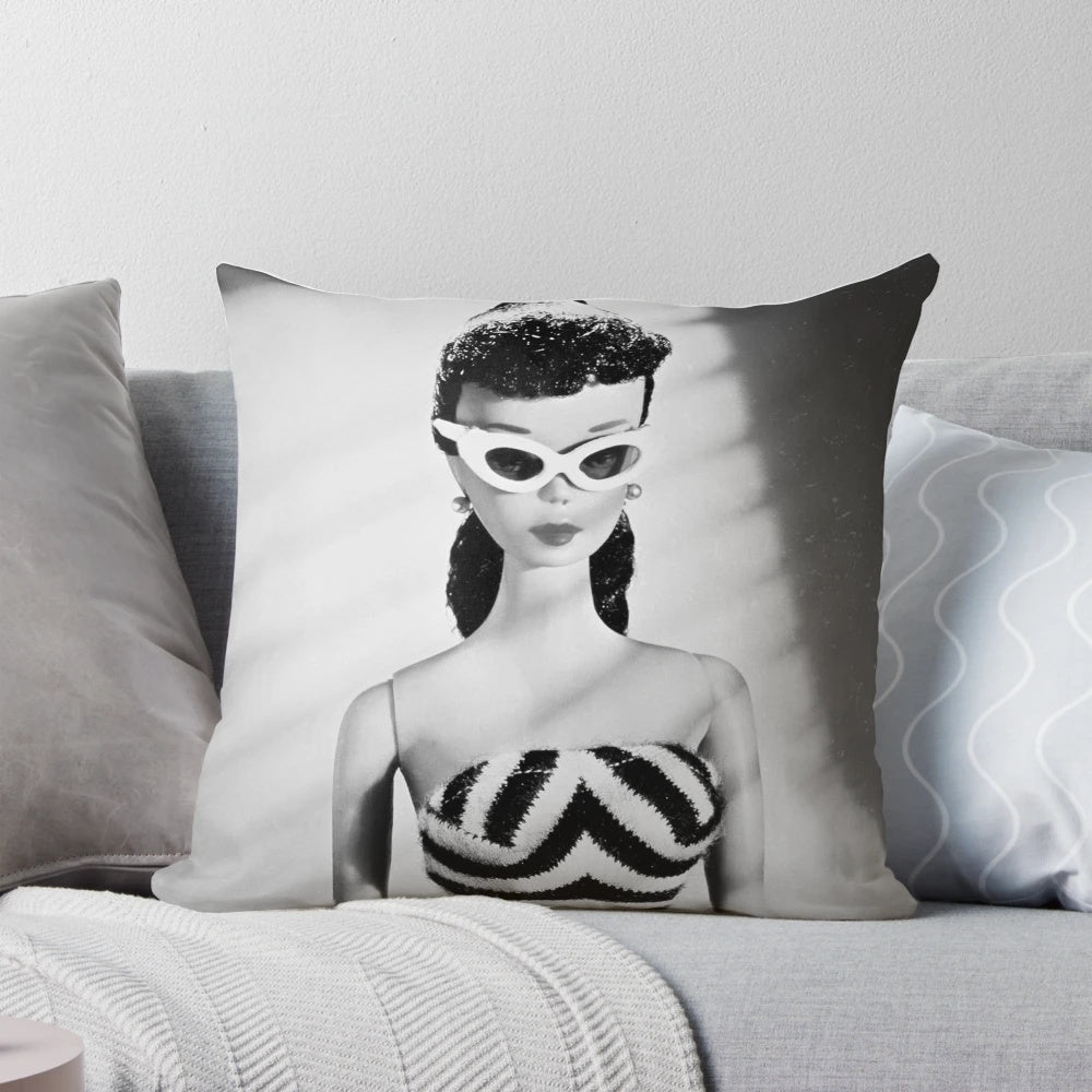 Vintage-style black and white decorative pillow featuring a retro doll design