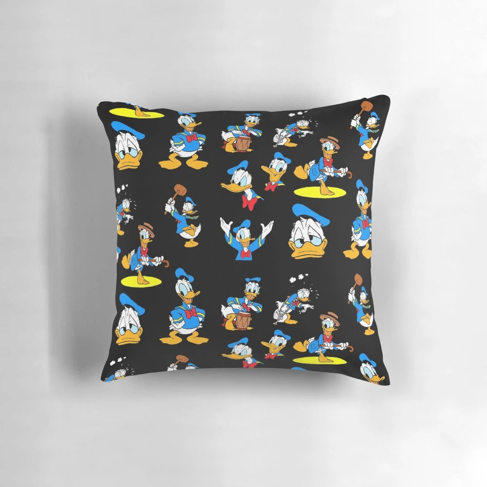 A colorful, retro-inspired pillow featuring a collage of iconic Donald Duck images in a vintage, aesthetic design.