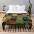 Retro dots plush blanket with midcentury modern pattern in teal, green, mustard, orange, blue, and turquoise