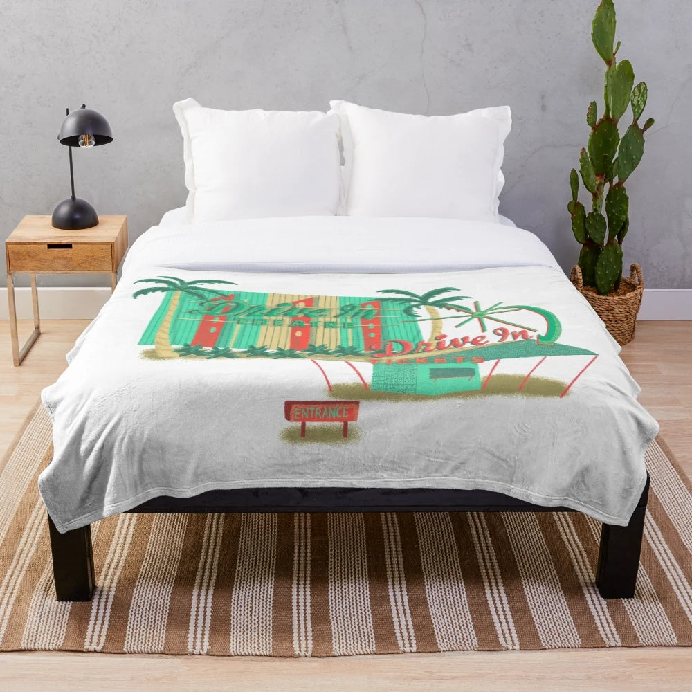 Plush blanket featuring a vintage drive-in theater design, perfect for a cozy movie night