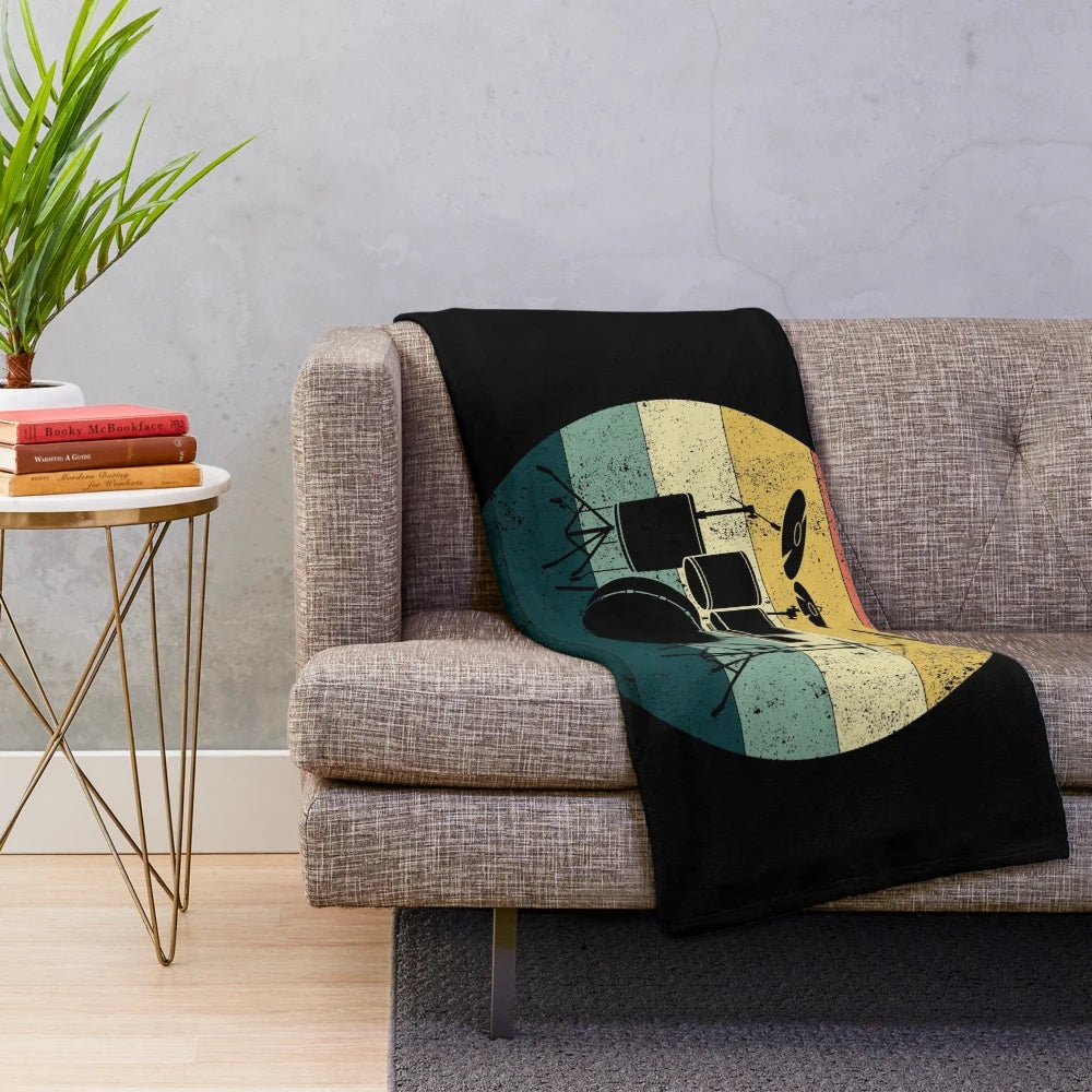 Retro drum plush blanket featuring a vintage drum set design