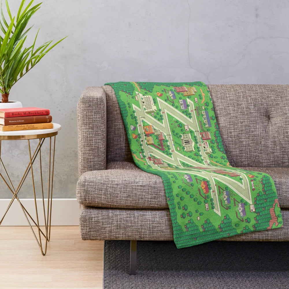 Earthbound Onett map plush blanket featuring pixel art and isometric town design