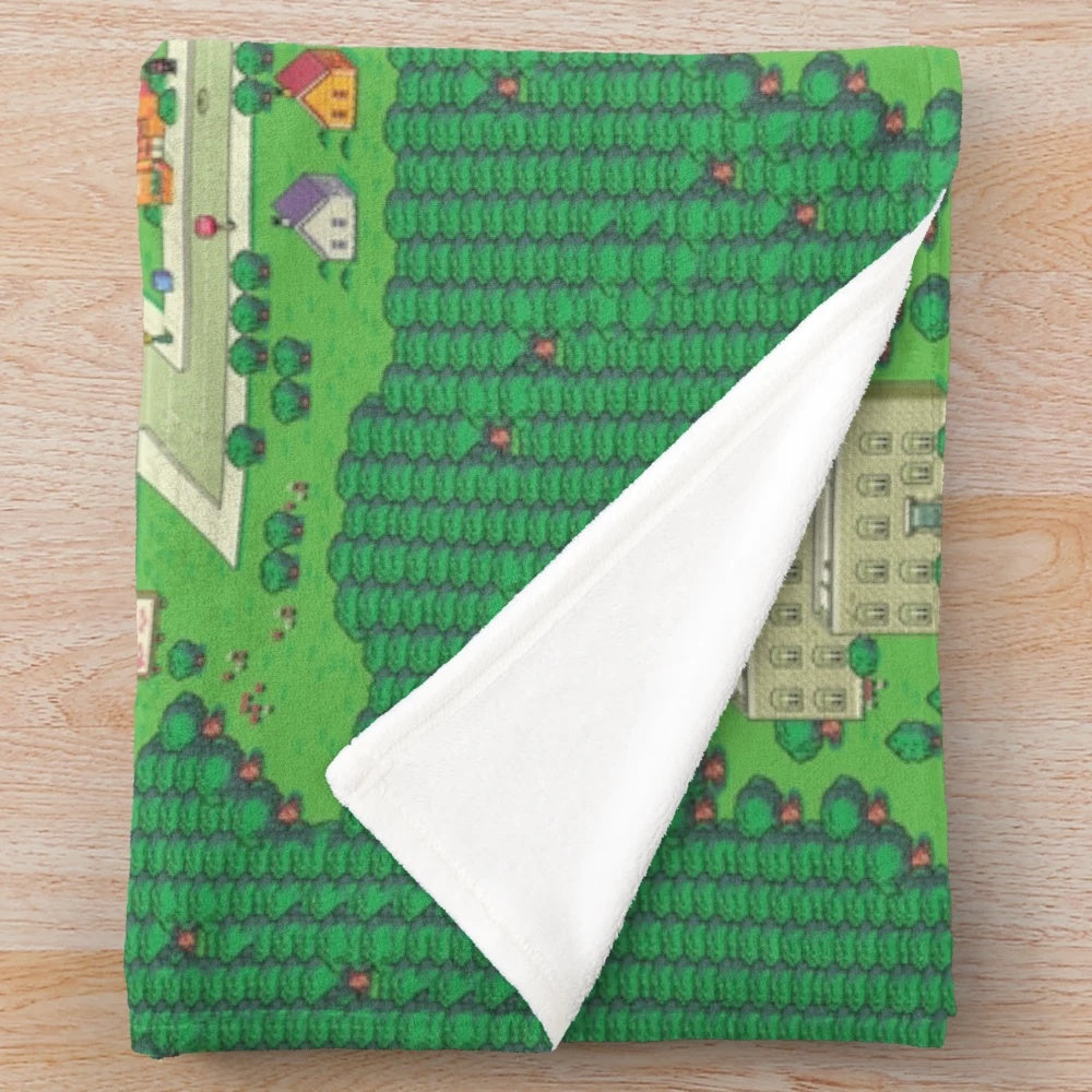 Earthbound Onett map plush blanket featuring pixel art and isometric town design