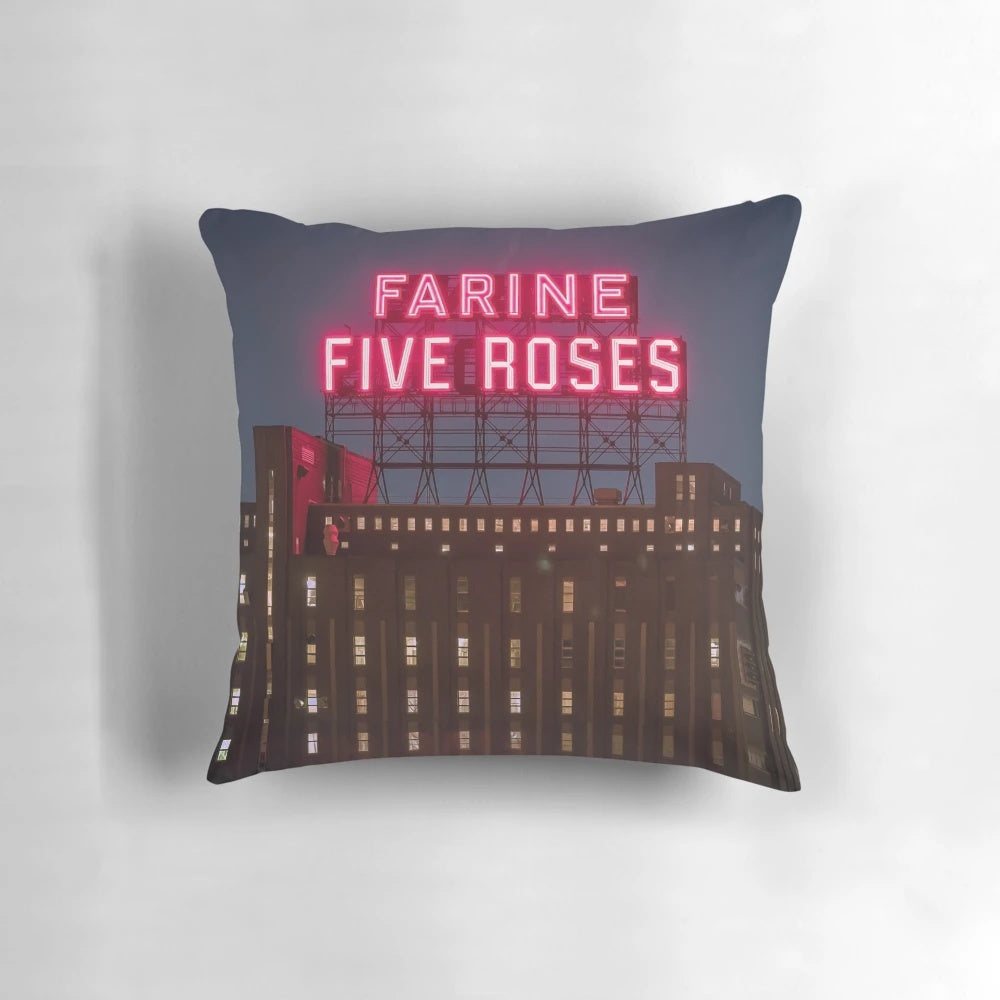 Vibrant Farine Five Roses night scene pillow with neon pink and glow accents, showcasing the iconic Montreal cityscape.