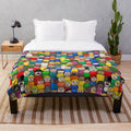 Cozy plush blanket with all-over Fisher Price Little People characters