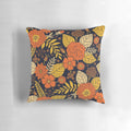 Retro floral 1970s pillow with a vintage flower and leaf design in shades of orange, yellow, brown, and navy.