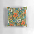 Colorful retro-style floral pillow with a vintage 70s boho botanical bouquet design