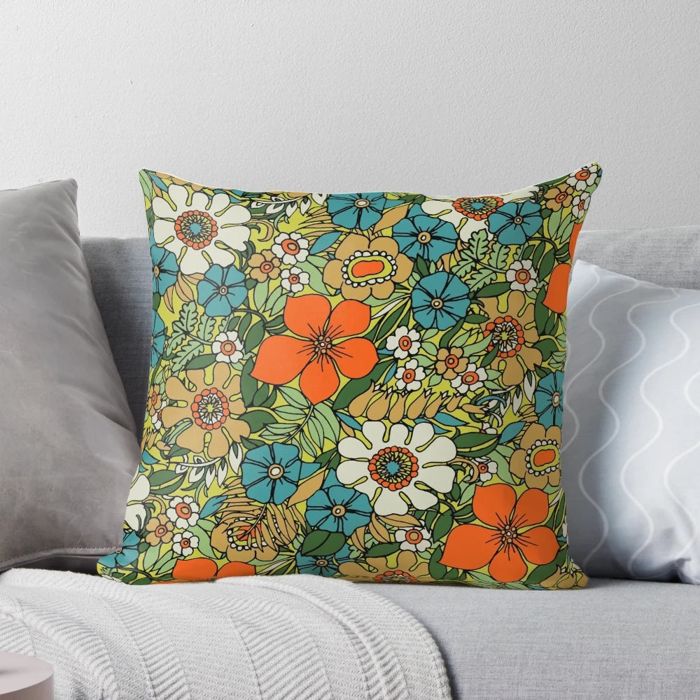 Colorful retro-style floral pillow with a vintage 70s boho botanical bouquet design