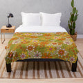 Retro floral flower power plush blanket in green, pink, and orange