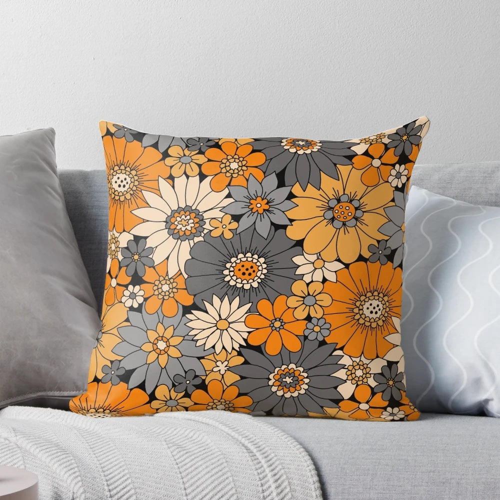 Retro floral Halloween pillow with orange, gray, and black daisies, dahlias, and mums