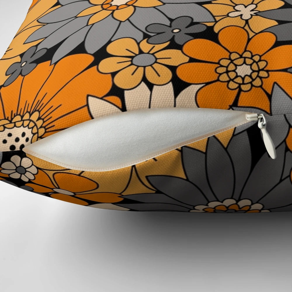 Retro floral Halloween pillow with orange, gray, and black daisies, dahlias, and mums