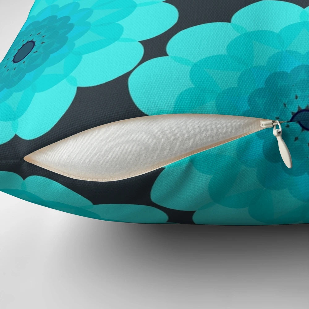 Retro floral patterned Margo pillow in shades of blue, teal, and grey