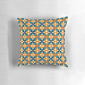 A blue and orange retro inspired floral pattern decorative pillow with a minimalistic, vintage aesthetic.