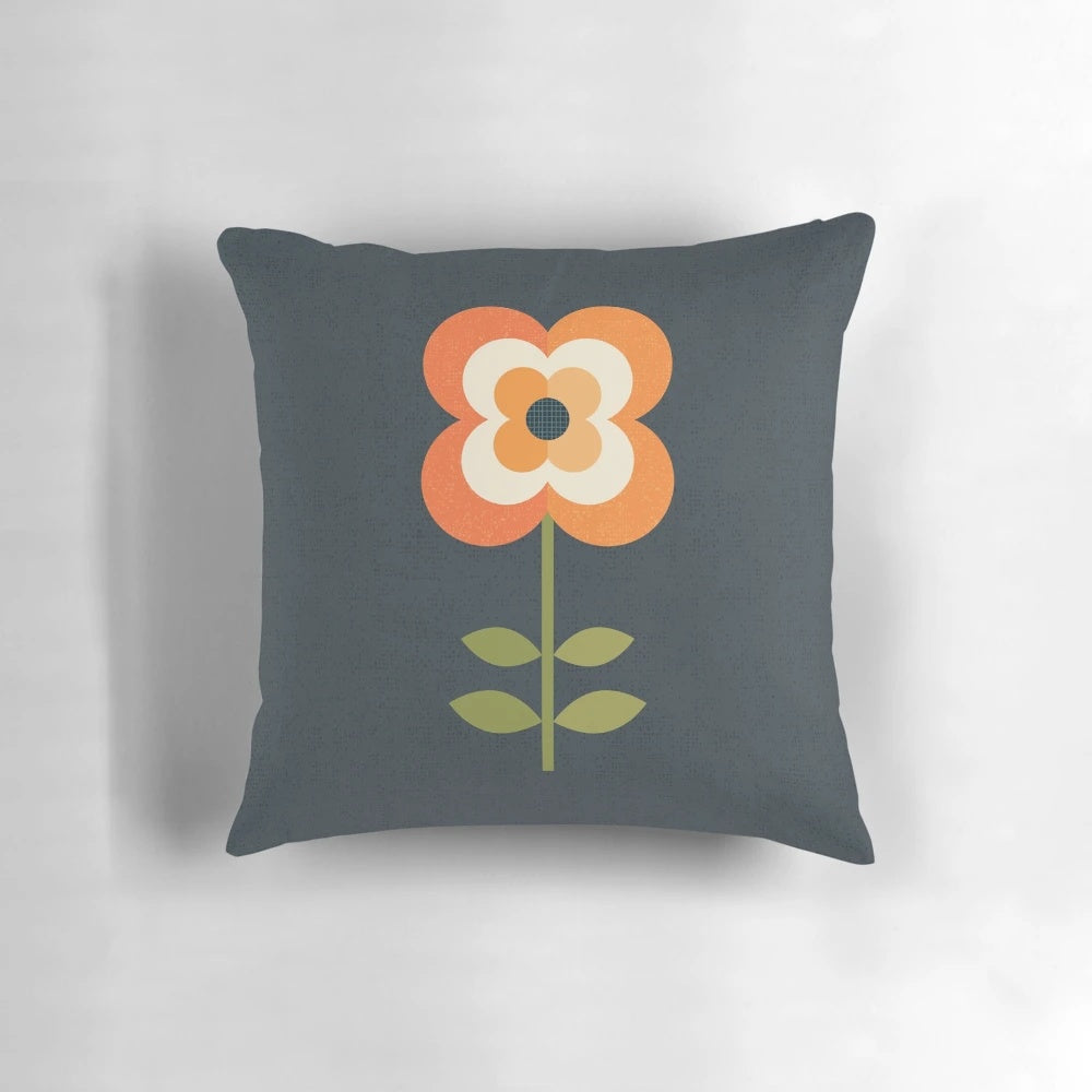 Retro floral pattern pillow in orange and charcoal colors