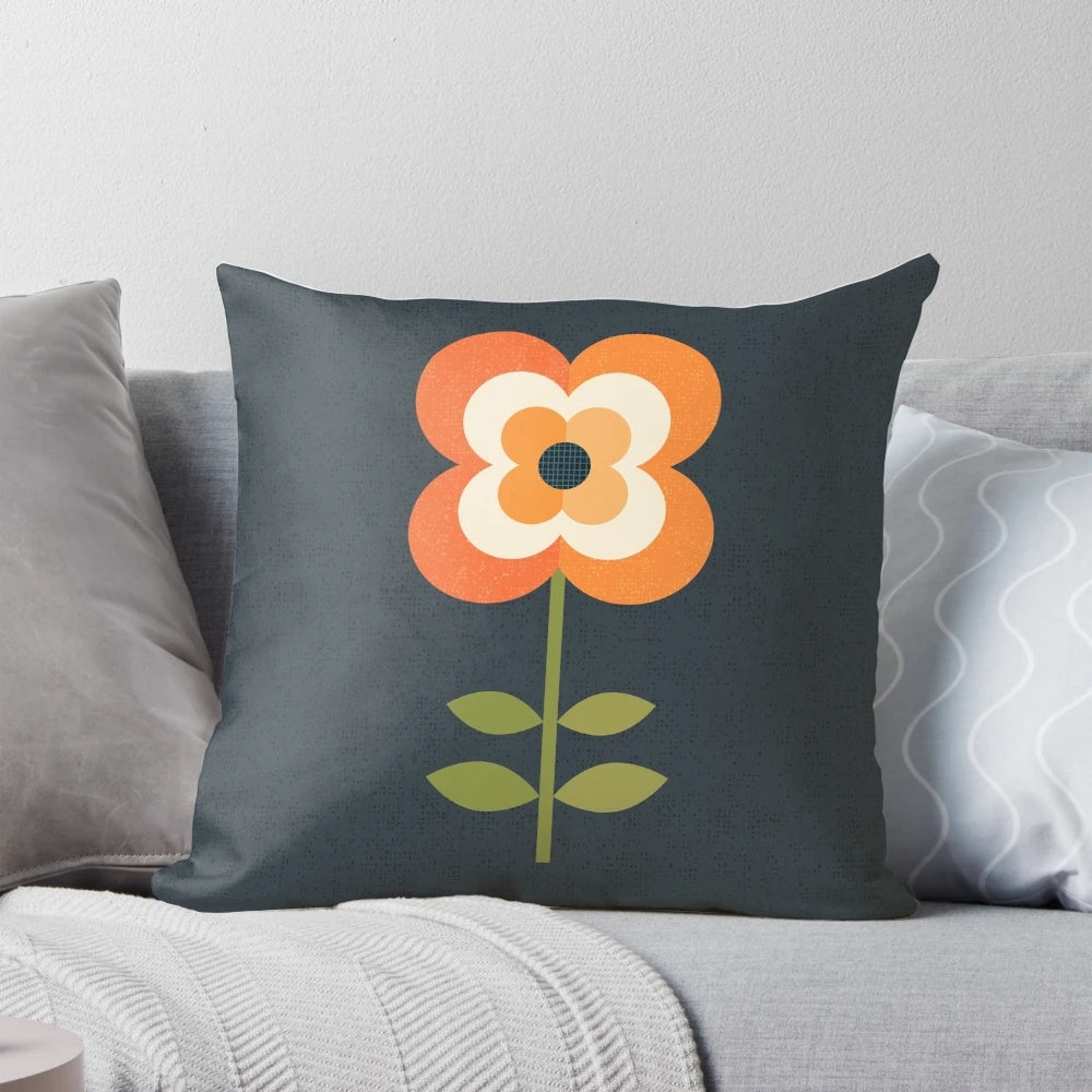 Retro floral pattern pillow in orange and charcoal colors