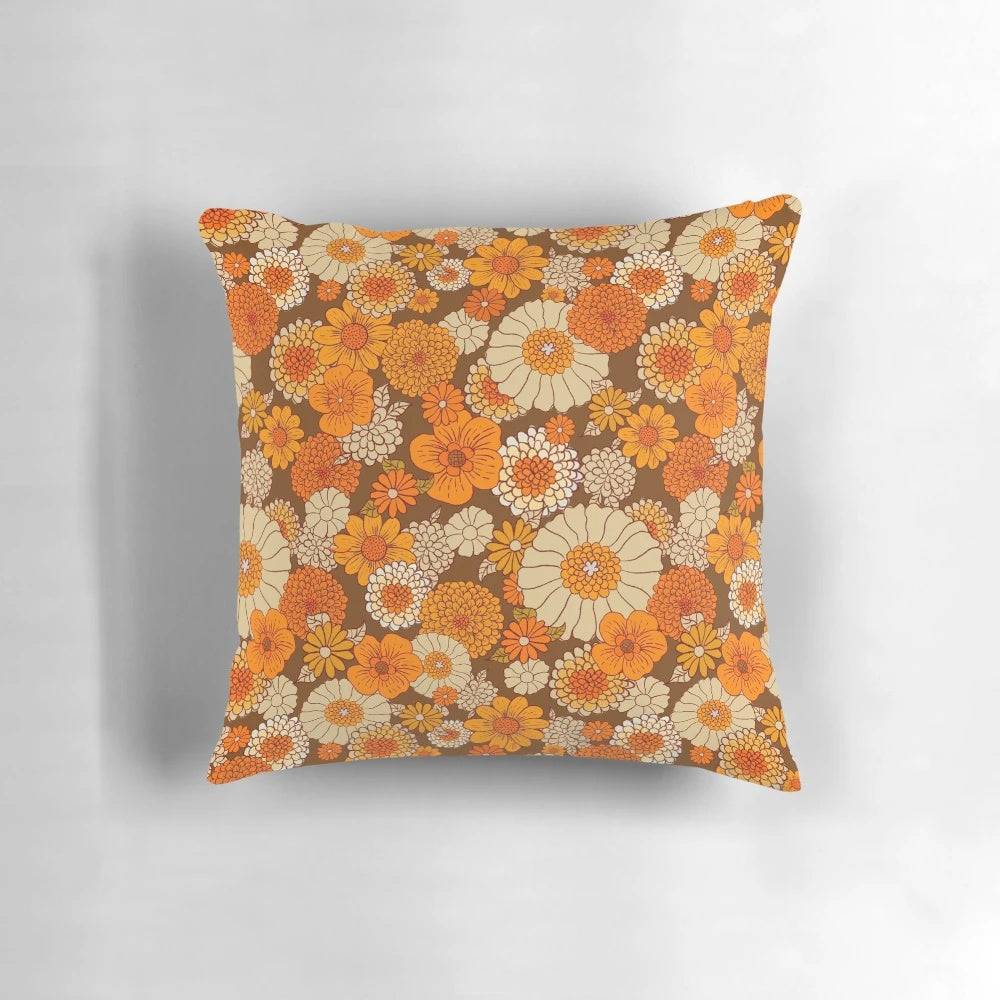 Colorful retro floral pattern pillow in shades of orange and brown