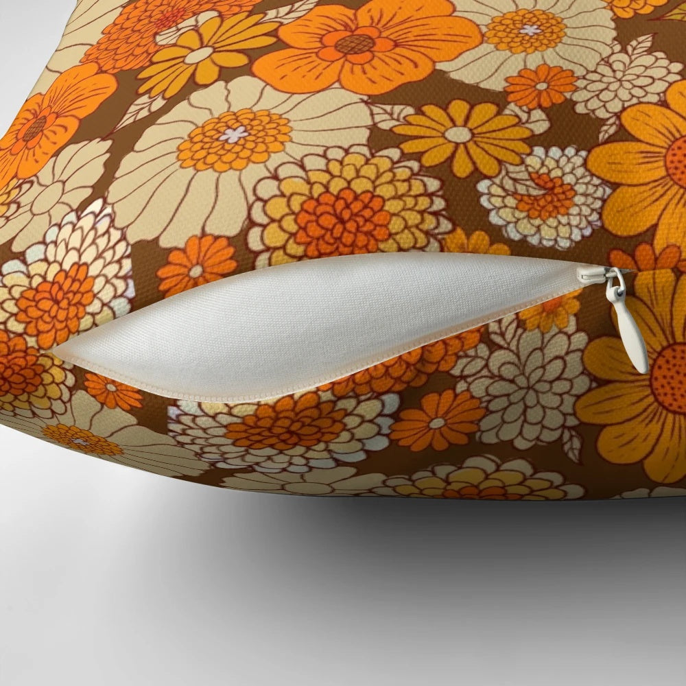 Colorful retro floral pattern pillow in shades of orange and brown