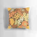 Colorful vintage-inspired floral pattern throw pillow in brown, yellow, orange, and ivory