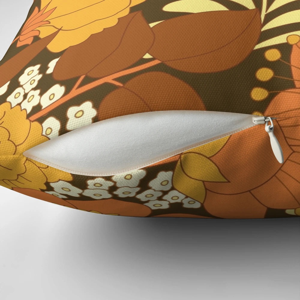 Colorful vintage-inspired floral pattern throw pillow in brown, yellow, orange, and ivory