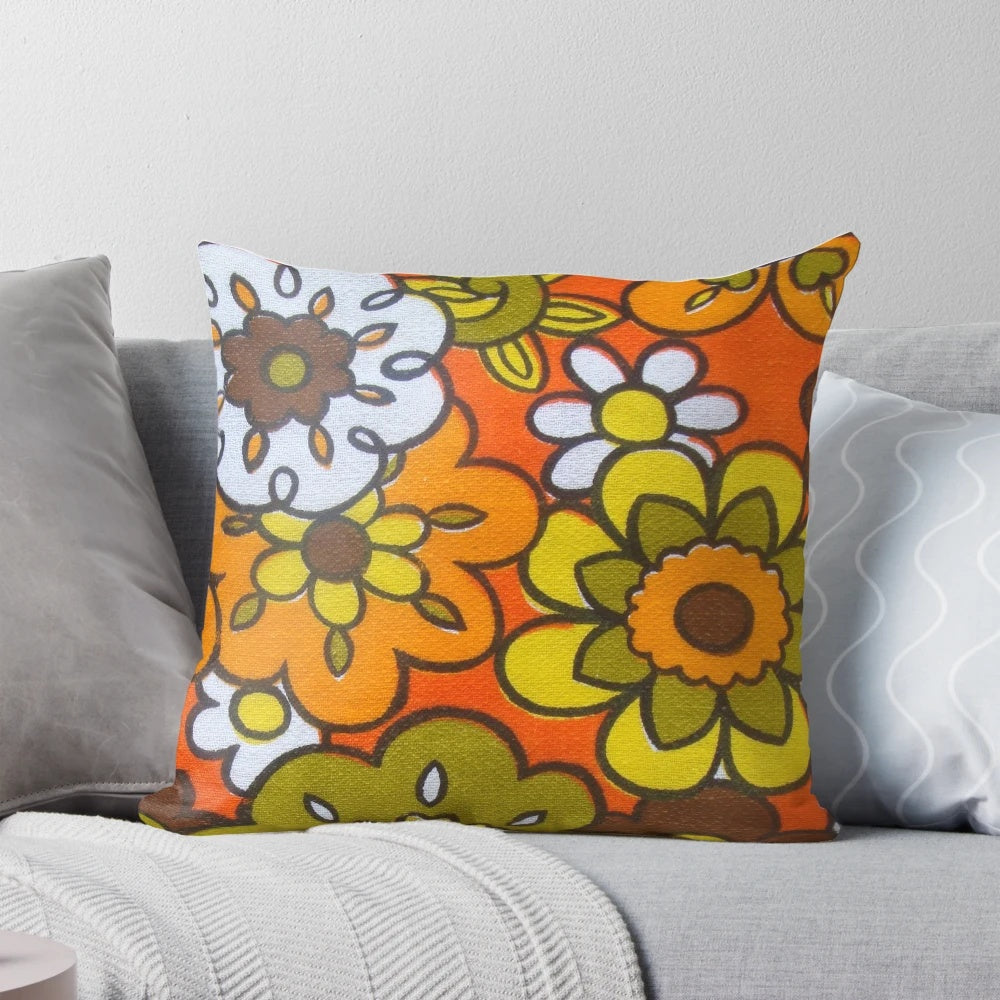 Vintage-inspired floral print pillow in avocado green, harvest gold, brown, and orange colors