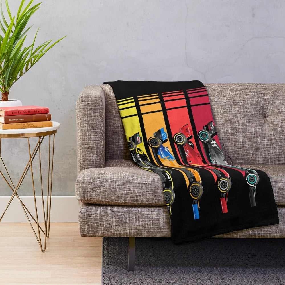 Plush blanket featuring vintage formula race cars