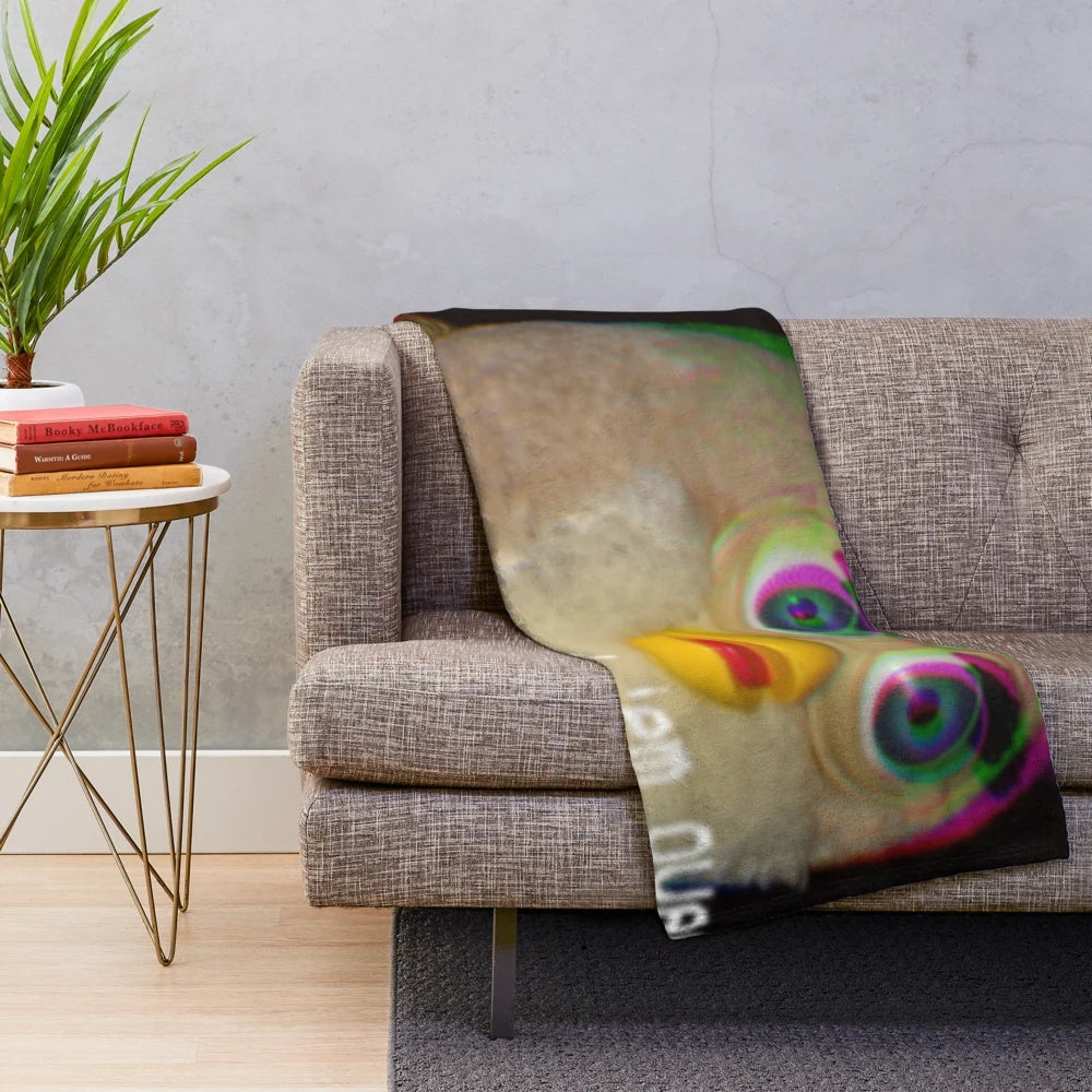 Cozy plush blanket featuring a vintage long furby design