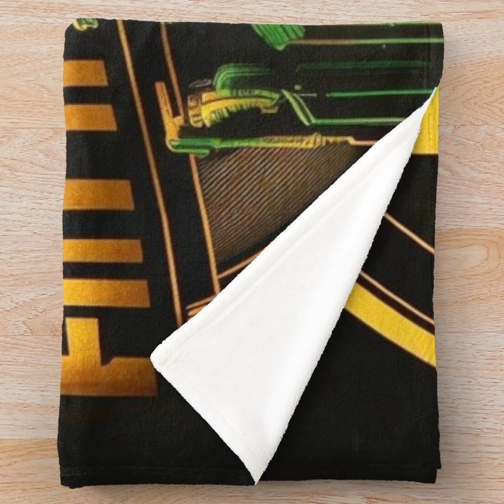Futuristic plush blanket with cityscape and movie theater inspired design