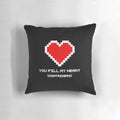 Retro video game-themed heart-shaped pillow with 8-bit graphics and bold colors