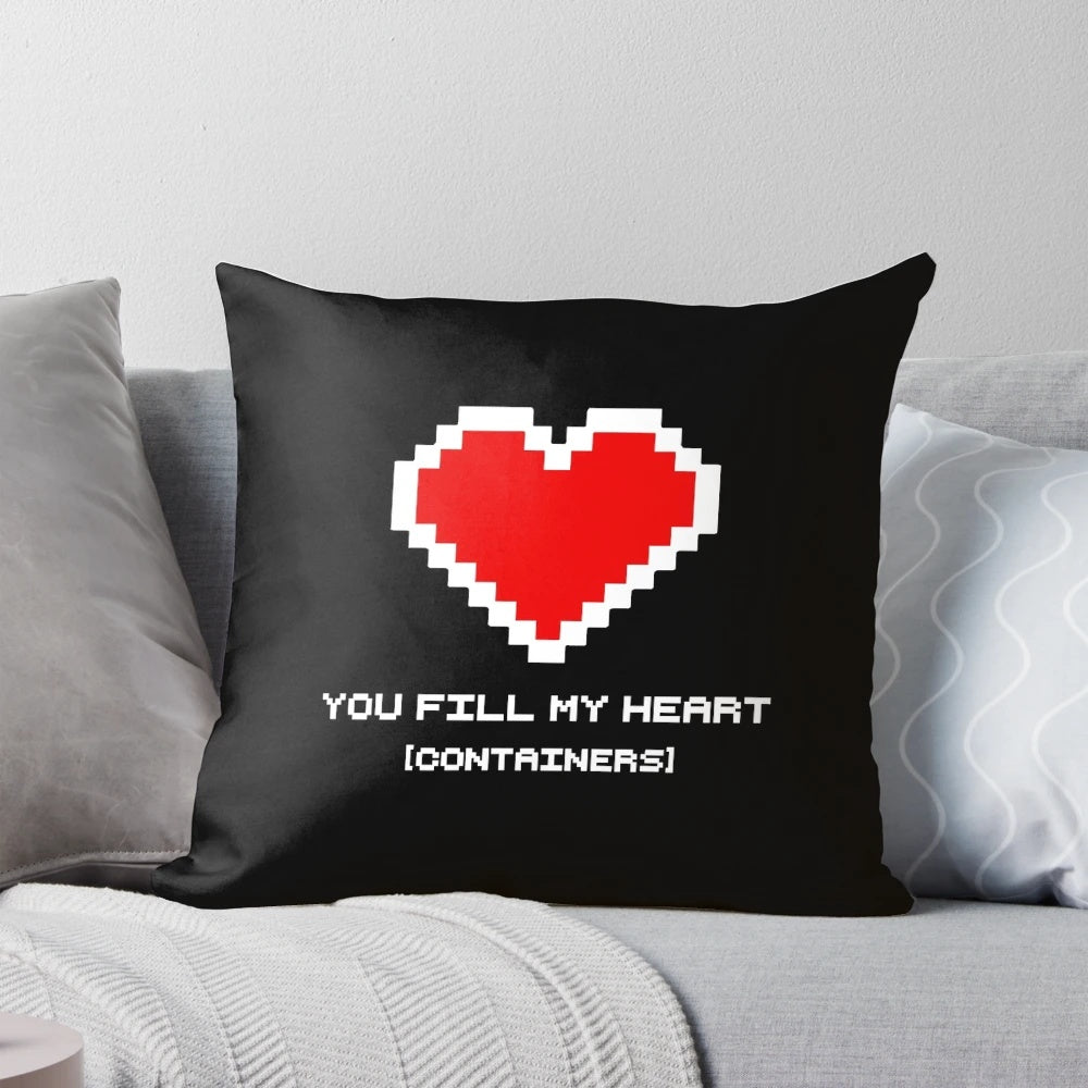 Retro video game-themed heart-shaped pillow with 8-bit graphics and bold colors