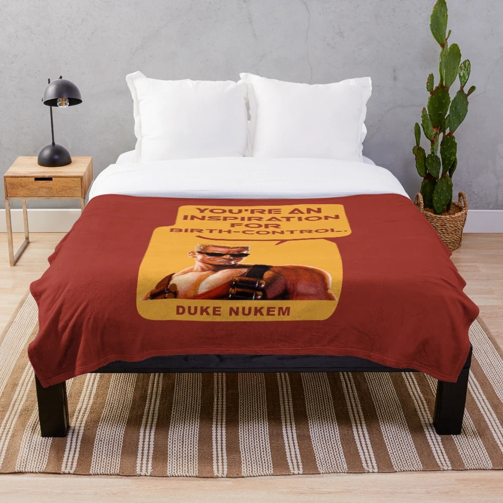 Duke Nukem inspired plush blanket with the quote "You're An Inspiration For Birth-Control