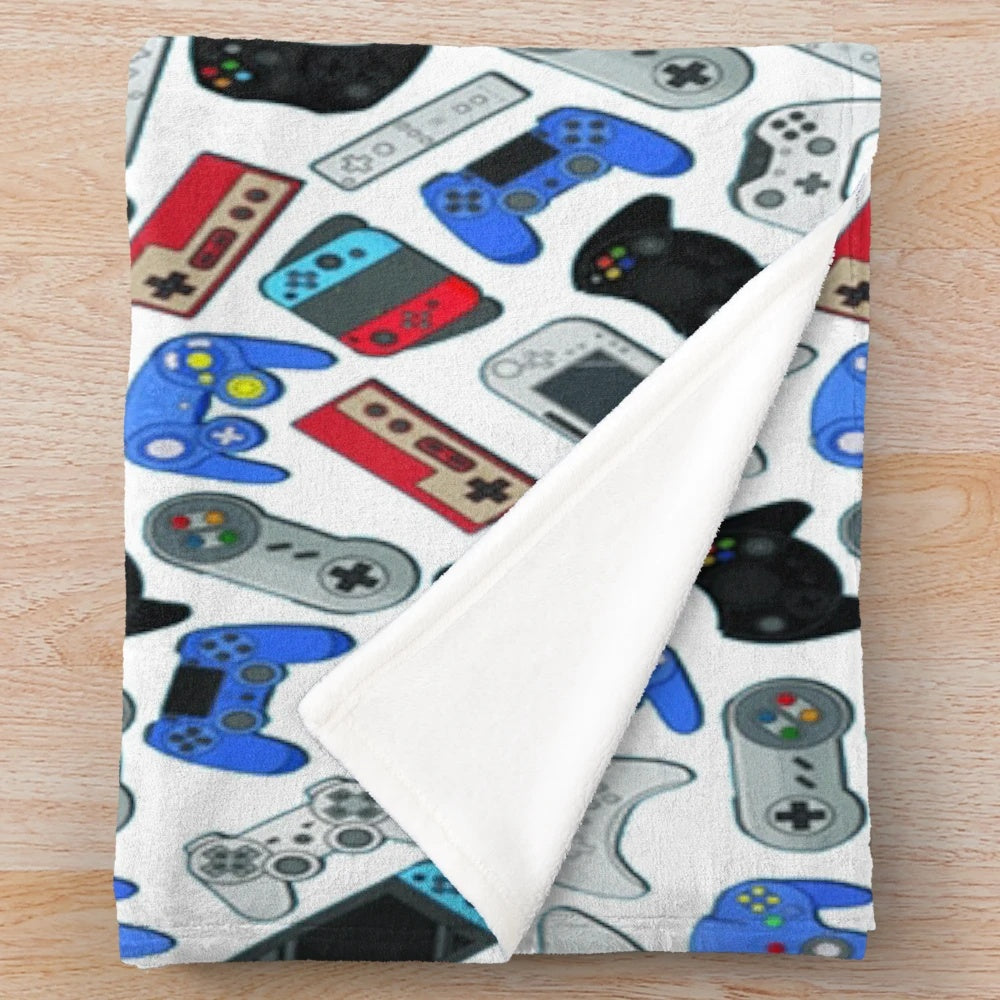 Cozy plush blanket featuring classic video game controllers design