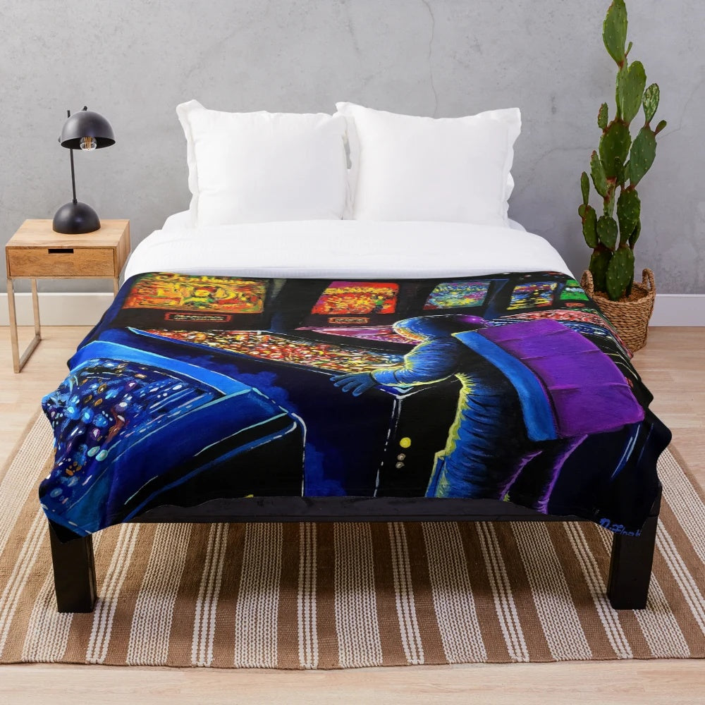 Pinball Wizard-inspired plush blanket with retro gaming and space-themed elements