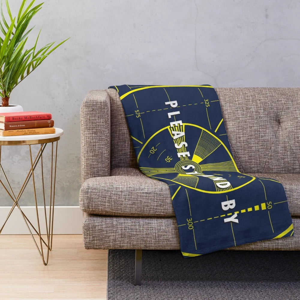Plush blanket with "Please Stand By" retro gaming design