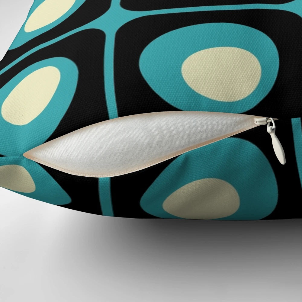 Retro geometric pillow with a vibrant gradient square and circle pattern in a midcentury modern style.