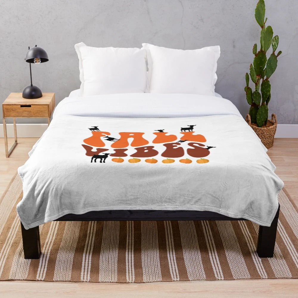 Retro-style plush blanket with a cute goat design, perfect for fall home decor