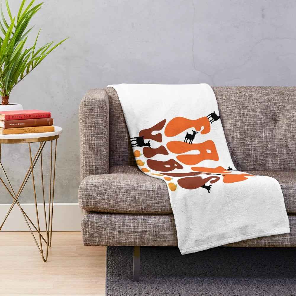 Retro-style plush blanket with a cute goat design, perfect for fall home decor