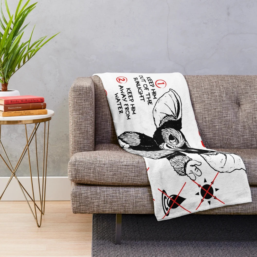 Gremlins plush blanket featuring Gizmo the mogwai and other 80s monster characters